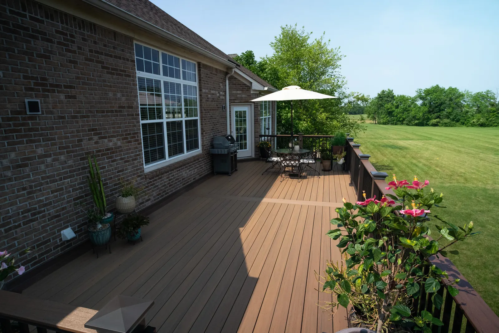 Composite deck table grill flowers top view in Westfield.