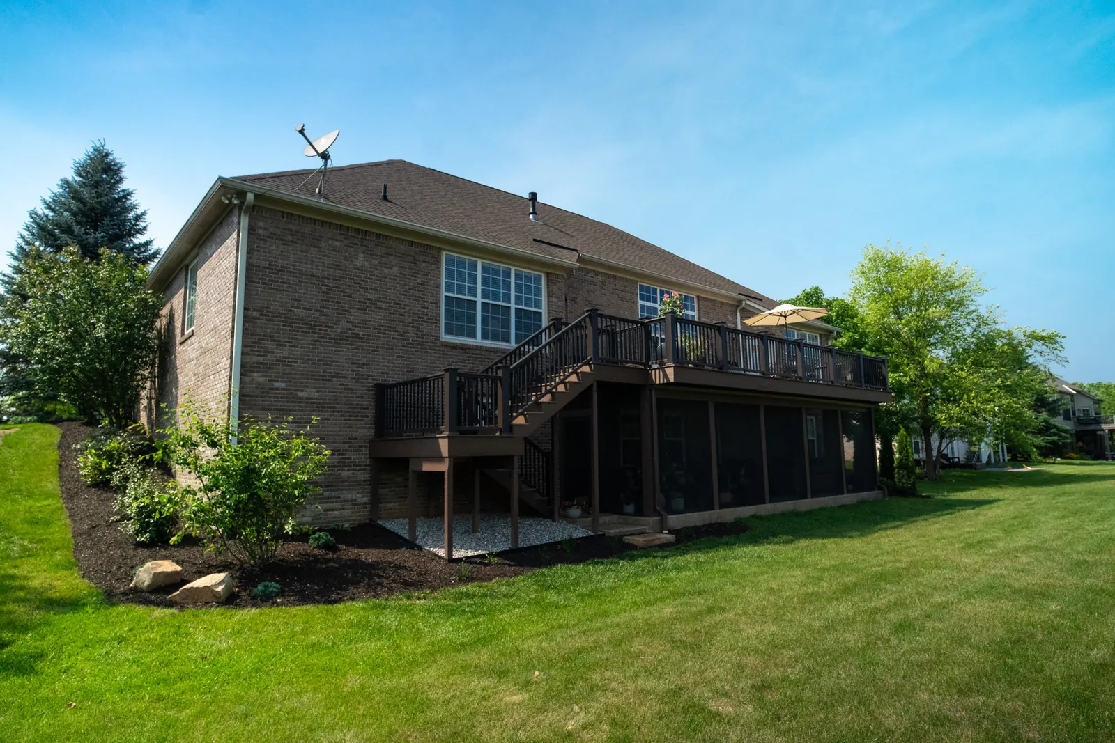 Composite deck under deck drainage screened porch in Westfield.