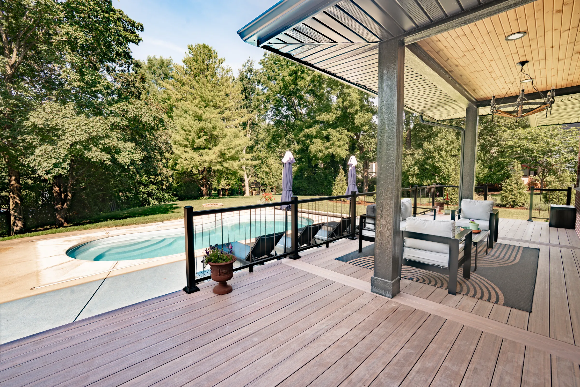Composite deck outdoor living space with cable railing in Indianapolis.