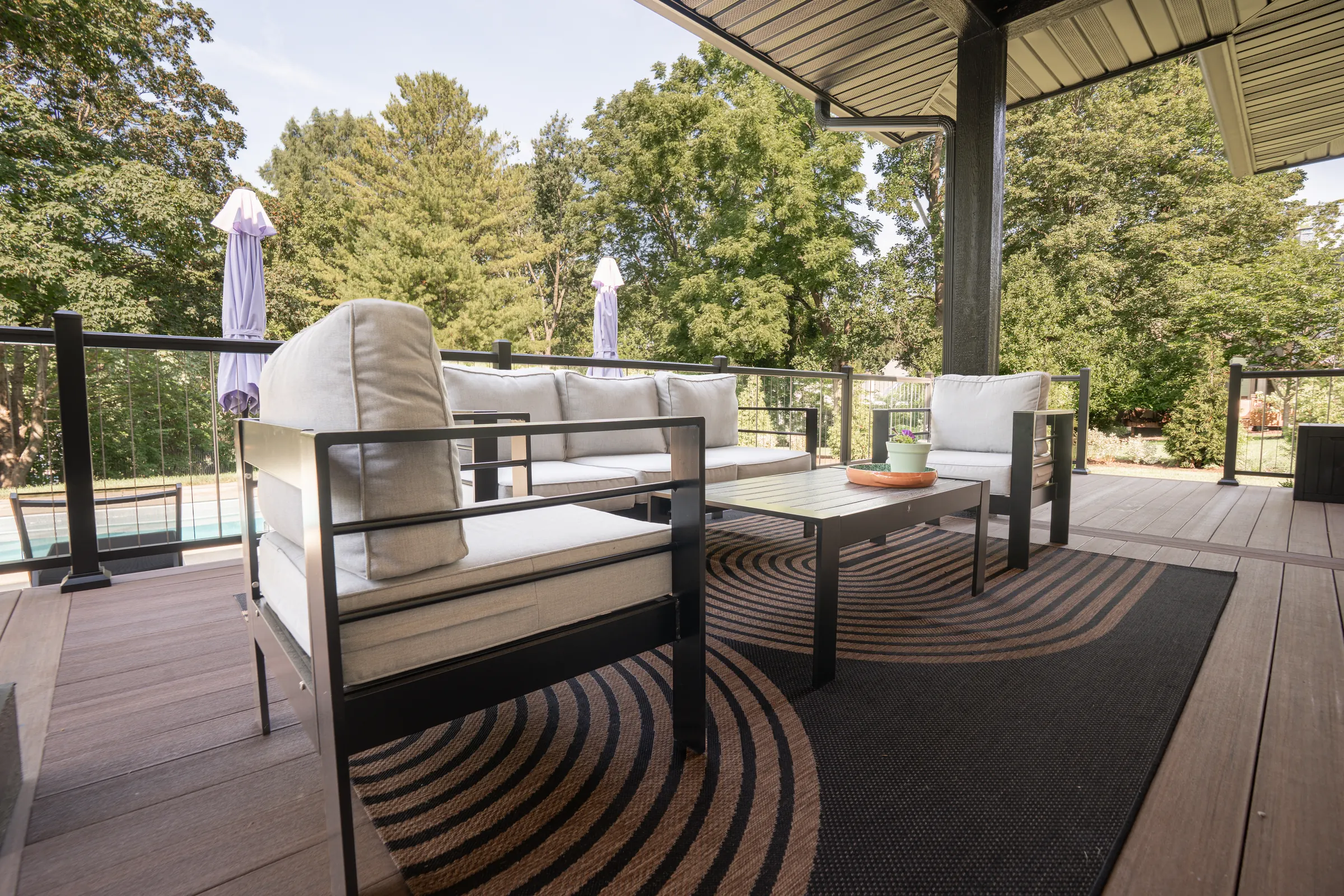 Composite deck outdoor living space cable railing in Indianapolis.
