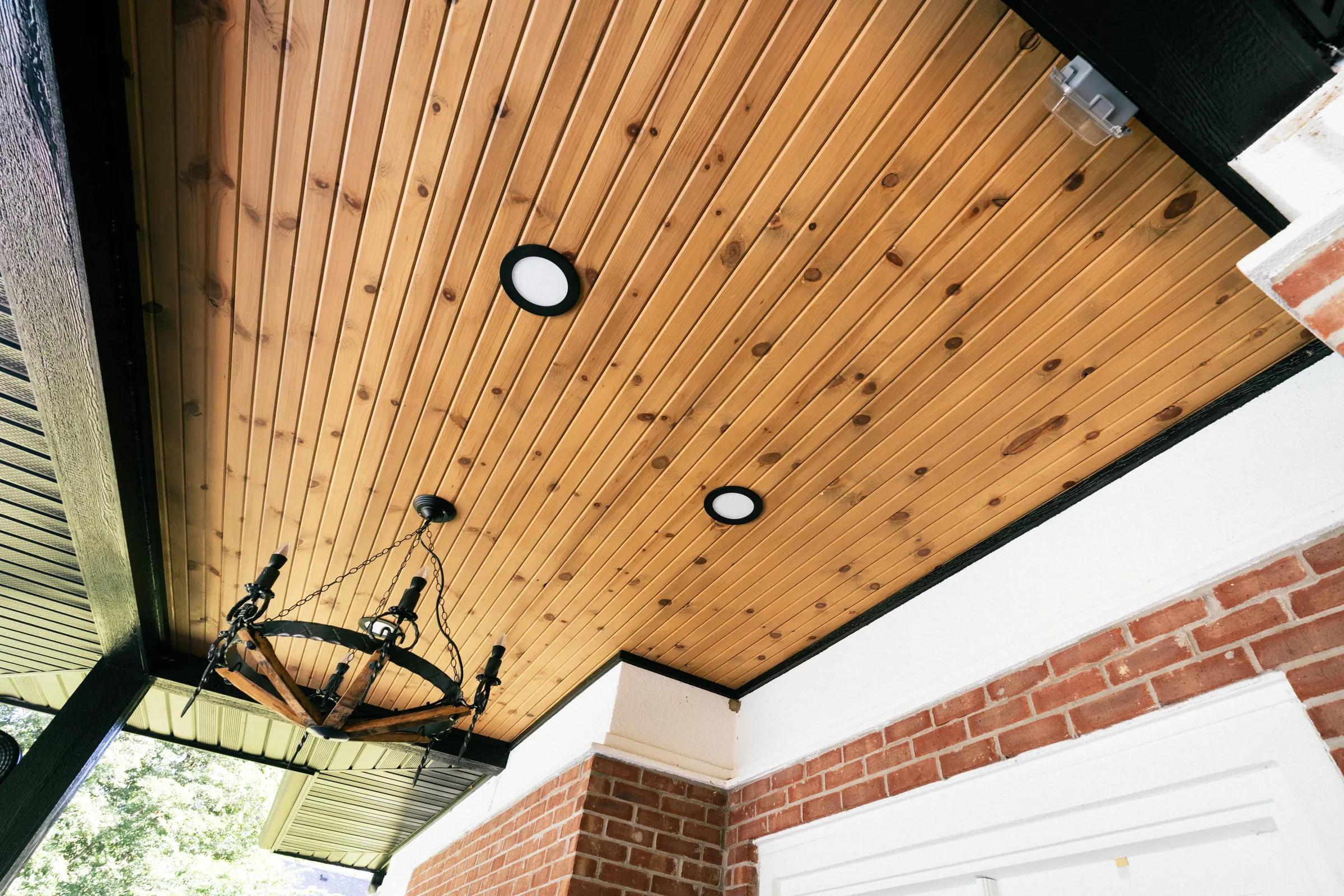 Outdoor living space with a stained wood ceiling in Indianapolis.