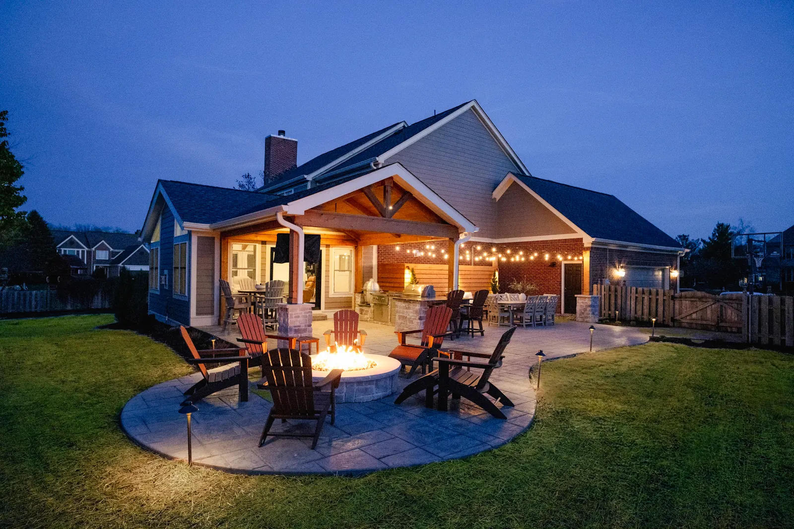 Attached structure outdoor kitchen gas fire pit patio dining table in Carmel.