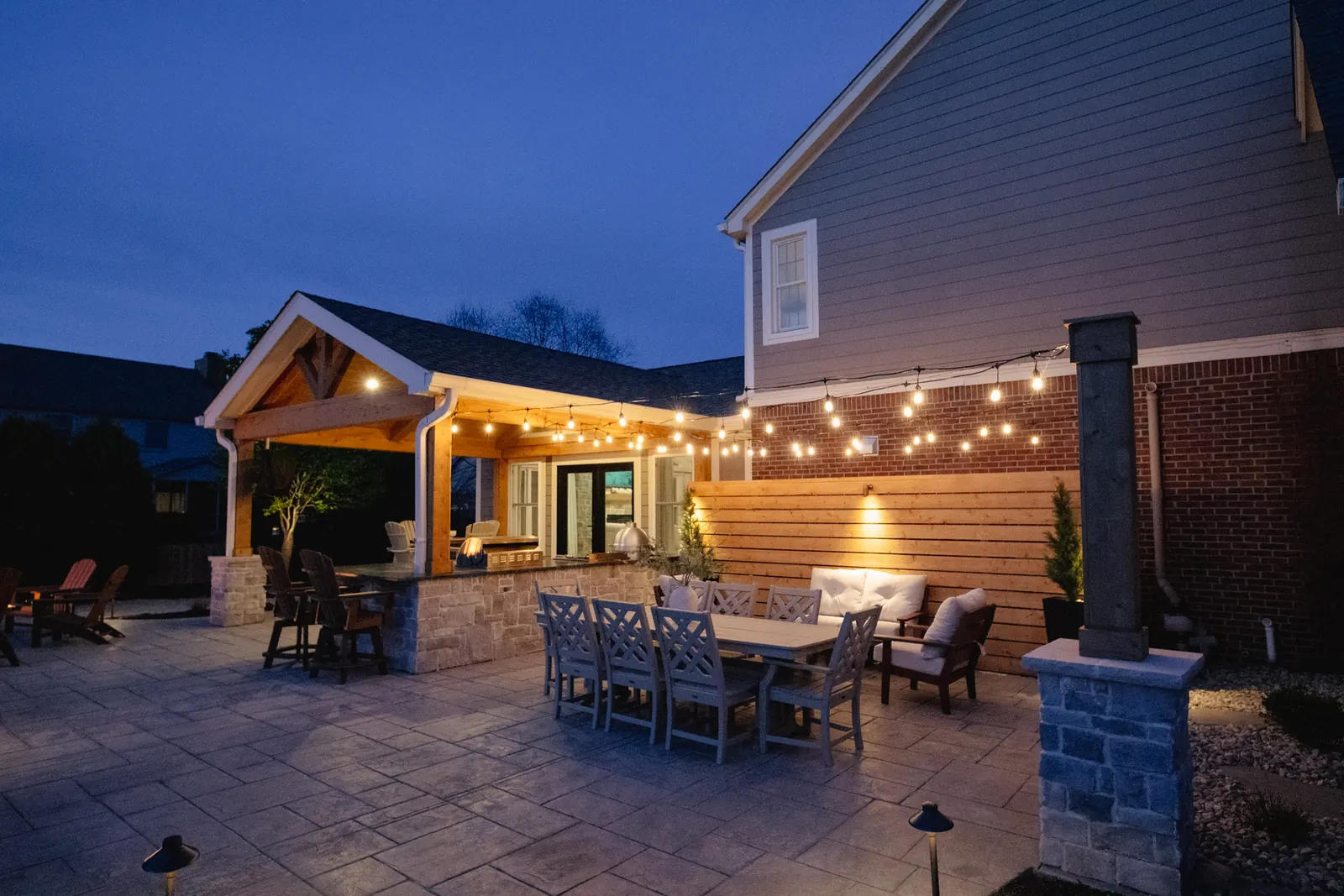 Attached structure outdoor kitchen patio dining table in Carmel, stamped.