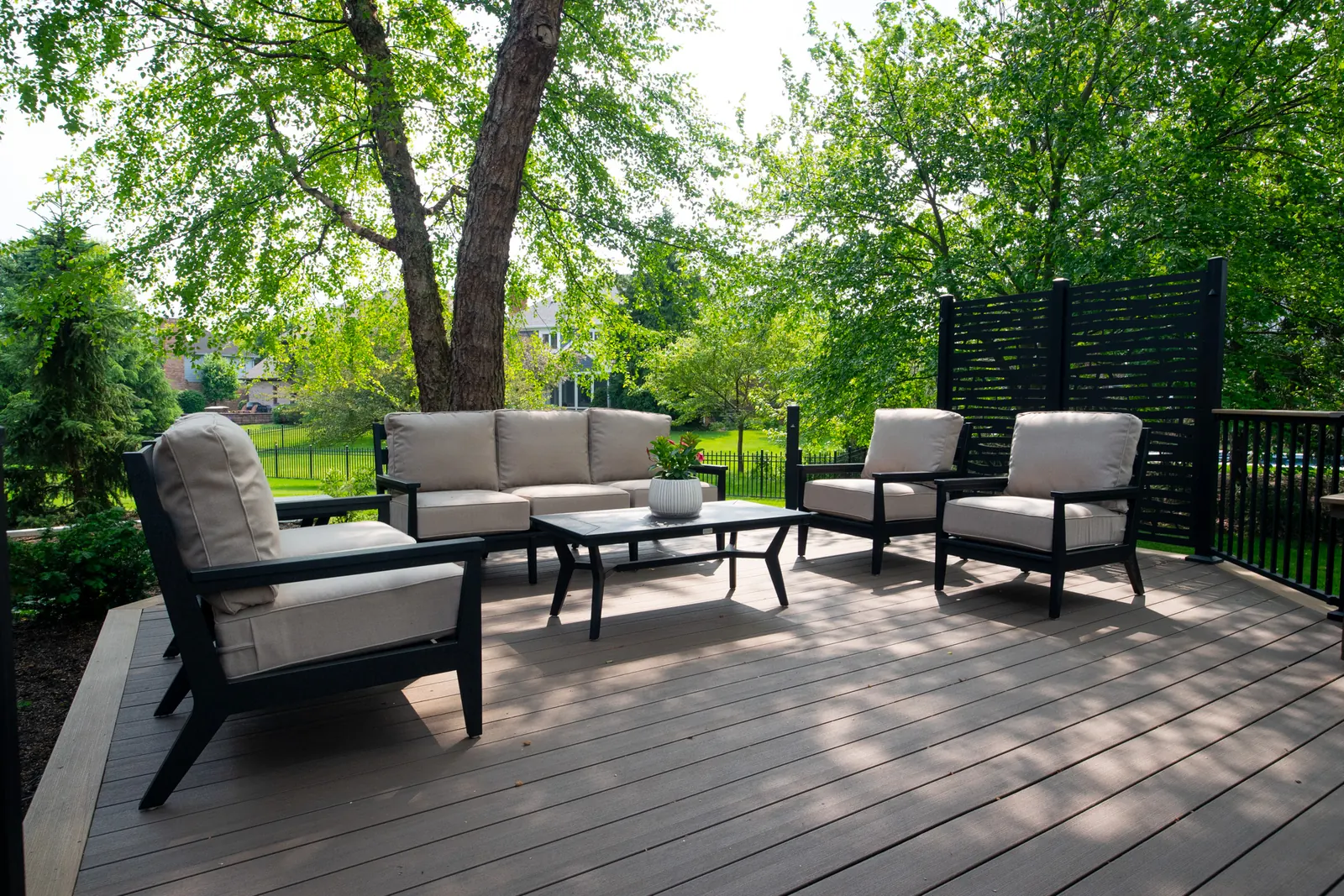 Composite deck lounge seating shade tree in Carmel, composite multi-level example.