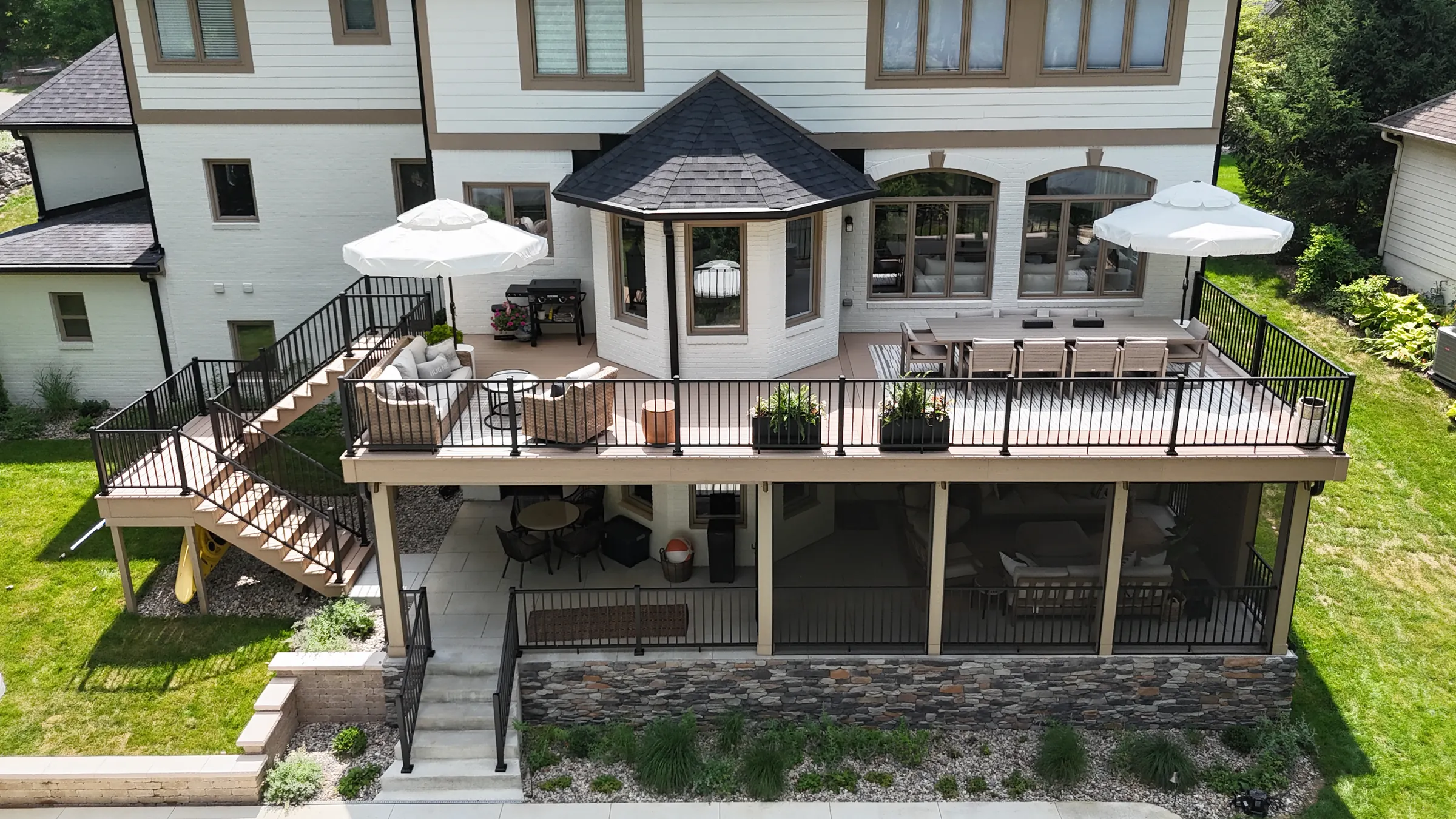 Aerial view composite deck under deck drainage screened porch pool in Indianapolis.