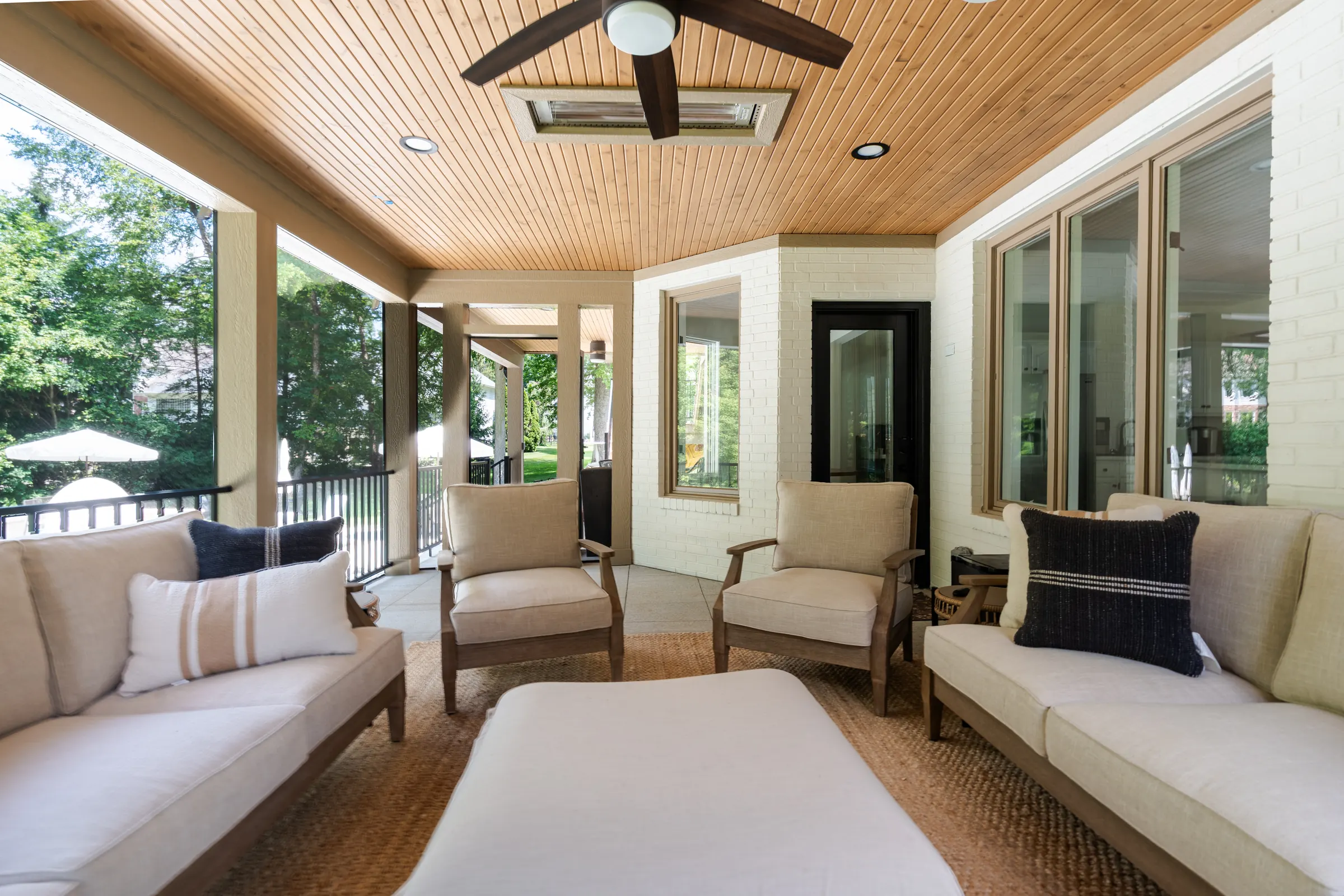 Composite deck under deck drainage screened porch outdoor heating outdoor entertainment center in Indianapolis.