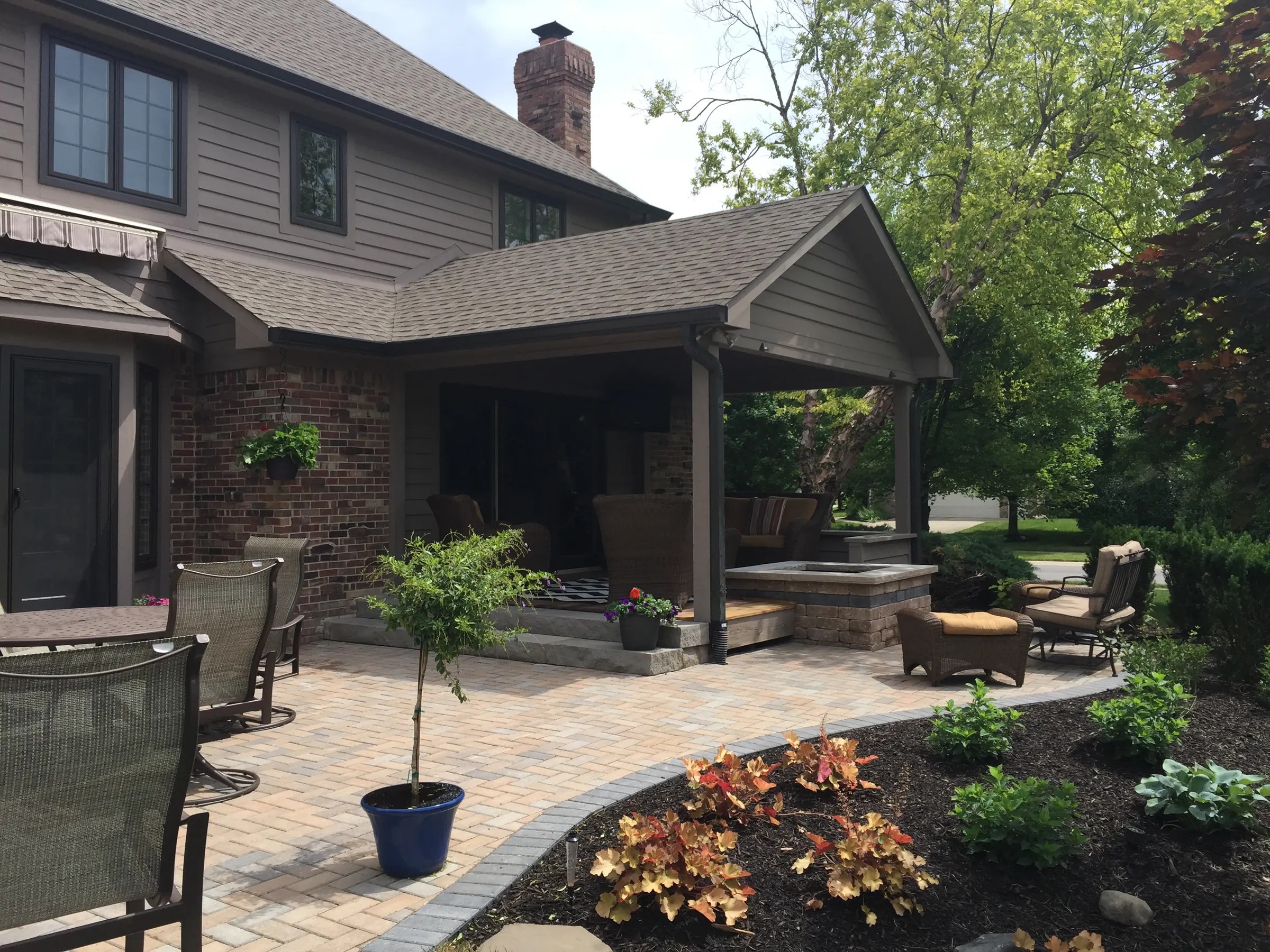 Attached structure with fire pit and paver patio in Carmel.
