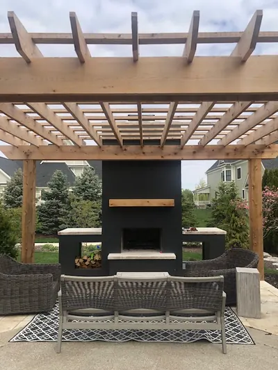 Modern pergola with fireplace and lounge area in Carmel.