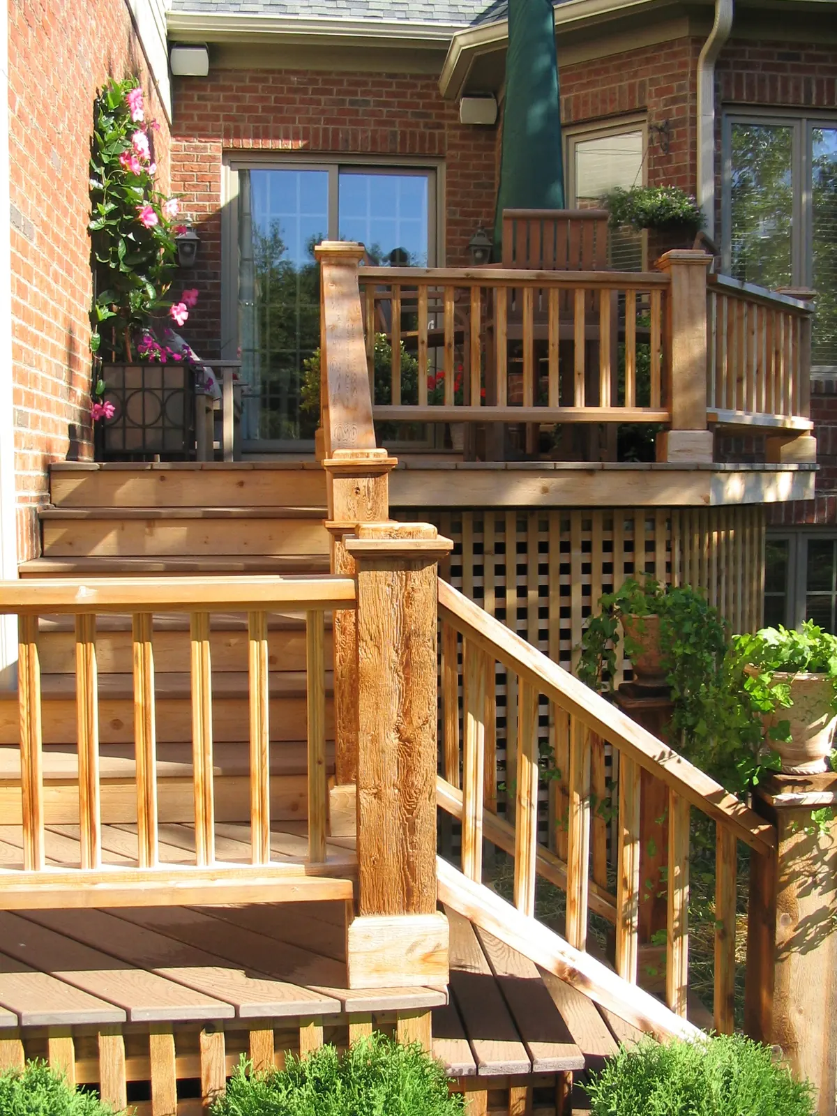 Wood deck with stairs and railing.
